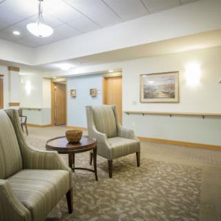 A cozy lobby area with comfortable seating and soft lighting.