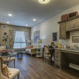 A cozy living room with modern decor and comfortable seating.