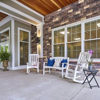 A cozy porch area with rocking chairs and a welcoming vibe.