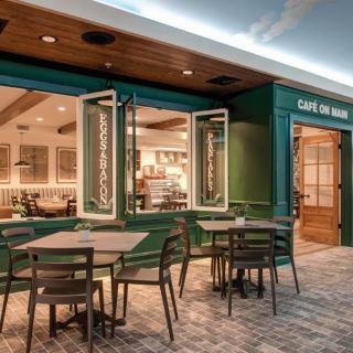 Charming cafe with inviting outdoor seating and modern interior design.