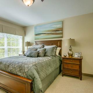 A cozy bedroom with stylish decor and soft lighting.