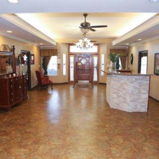 Spacious lobby area with elegant decor and a central reception desk.