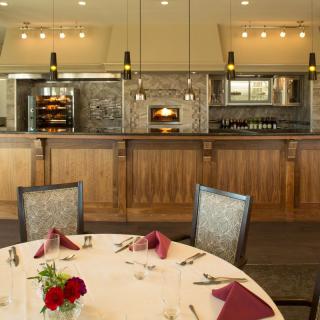 An elegantly set dining table in a restaurant with modern interior design.