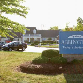 The entrance of Abbington, showcasing the sign and surrounding landscape.