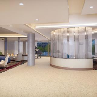 A modern lobby featuring elegant furniture and a spacious design.
