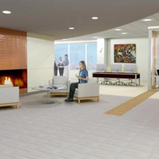 A modern lobby with comfortable seating and a cozy fireplace.