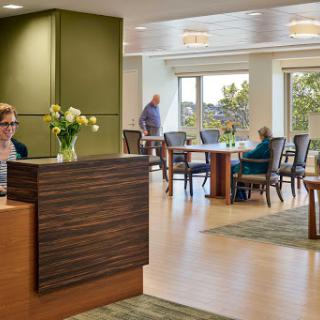 A modern reception area with a welcoming atmosphere, featuring stylish furniture and ample natural light.