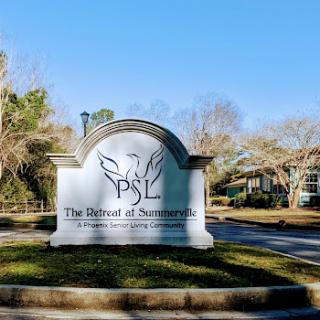 Welcome sign for a community, showcasing nature and a serene environment.