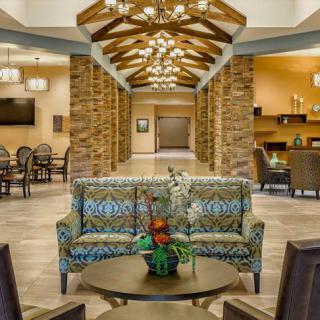 A modern lobby with elegant furnishings and warm lighting.