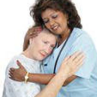 A nurse offering comfort and support to a patient.
