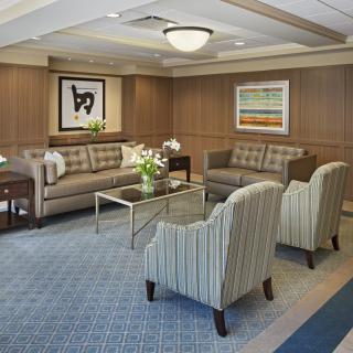 A stylish and comfortable living room with sofas, armchairs, and modern decor.
