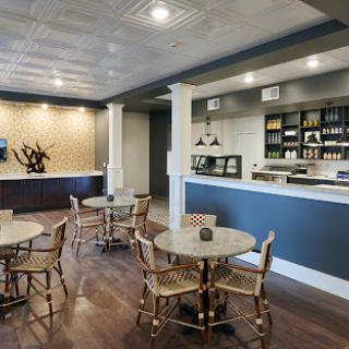 A modern caf interior featuring stylish furniture and a welcoming bar area.