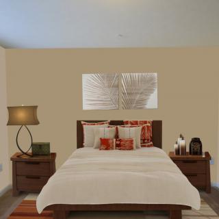 A cozy bedroom with a neatly made bed, flanked by nightstands and a stylish lamp.