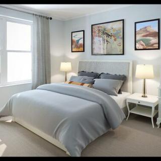 A serene bedroom decorated with neutral tones and modern artwork.