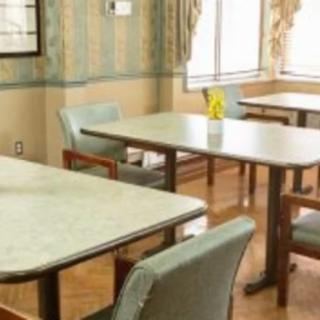 Empty dining room with tables and chairs.
