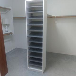 An empty shelving unit in a closet for organization and storage.