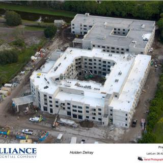 Aerial view of a construction site for a large building complex.