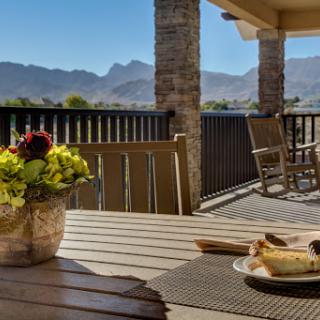 A serene outdoor setting with a beautiful mountain backdrop, perfect for enjoying a meal and the fresh air.
