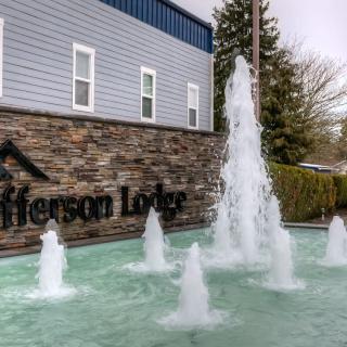 A view of a fountain in front of the Jefferson Lodge building.