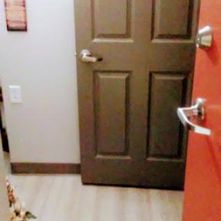A view of a doorway leading into an interior space.