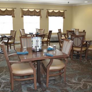 A cozy restaurant dining area with neatly arranged tables and chairs.
