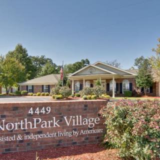 Entrance to NorthPark Village, showcasing the main building and surrounding landscape.