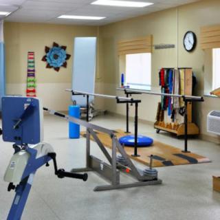 A rehabilitation room equipped with various exercise and therapy equipment.