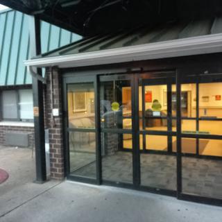 Main entrance with glass doors showcasing a modern architectural design.