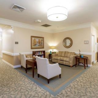 A cozy living room with comfortable seating and elegant decor.