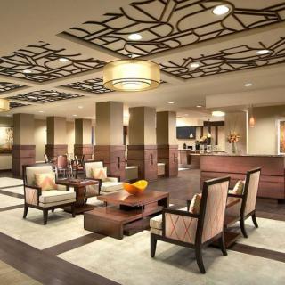 A modern hotel lobby with comfortable seating and stylish decor.