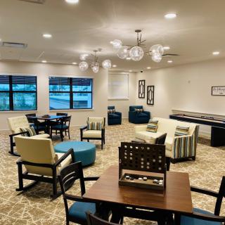 A modern lounge area with comfortable seating and ambient lighting.