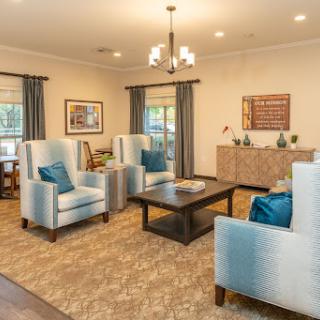 A stylish and inviting living room with modern furniture and blue accents.