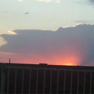 A beautiful sunset with clouds silhouetted against the colorful sky.