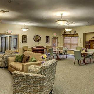 A cozy living room with comfortable seating and warm lighting.