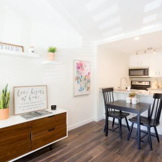 Bright and modern kitchen dining area with wooden floors and stylish decor.