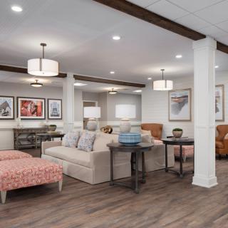 A cozy living room featuring modern furniture and stylish decor accents.
