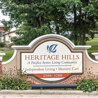 Entrance sign for Heritage Hills, a senior living community offering independent living, assisted living, and memory care.