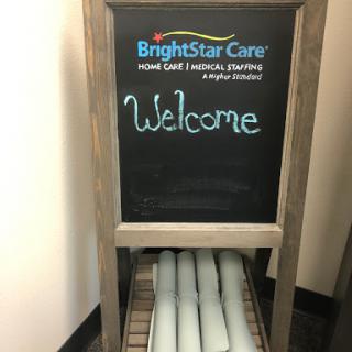 A welcoming sign from BrightStar Care, inviting guests with a friendly message.