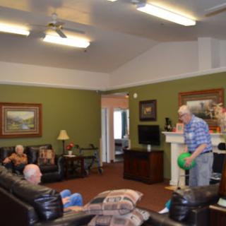 Seniors enjoying leisure time in a cozy recreation room.