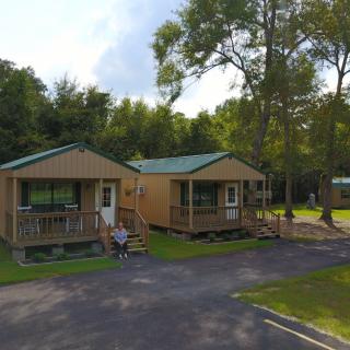 Cozy cabins nestled among trees, ideal for a peaceful outdoor retreat.