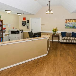A welcoming reception area with a front desk and seating arrangement.