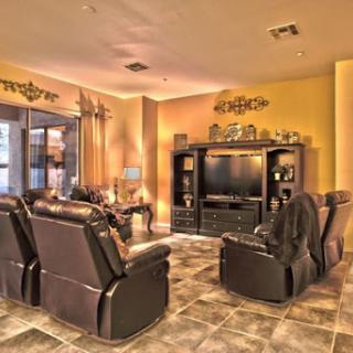 A cozy living room featuring comfortable recliners and a stylish entertainment center.