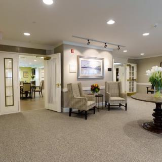 A spacious lobby area with elegant seating and decor.