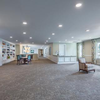 A spacious, well-lit lobby with comfortable seating and large windows.