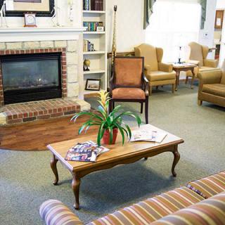 Cozy living room with a fireplace and comfortable seating.