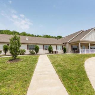 A well-kept exterior view of a residential building with landscaped pathways.
