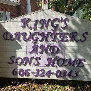 Sign for King's Daughters and Sons Home with contact number.