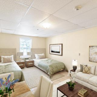 A cozy bedroom featuring two twin beds, a sofa, and stylish decor.
