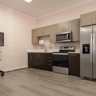 A modern kitchen featuring stainless steel appliances and contemporary cabinetry.