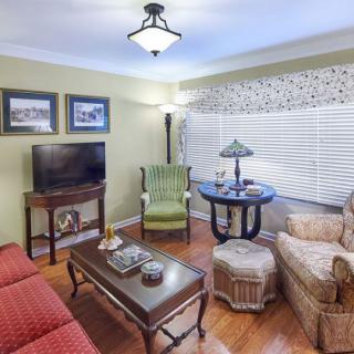 A cozy living room with comfortable seating and a television.